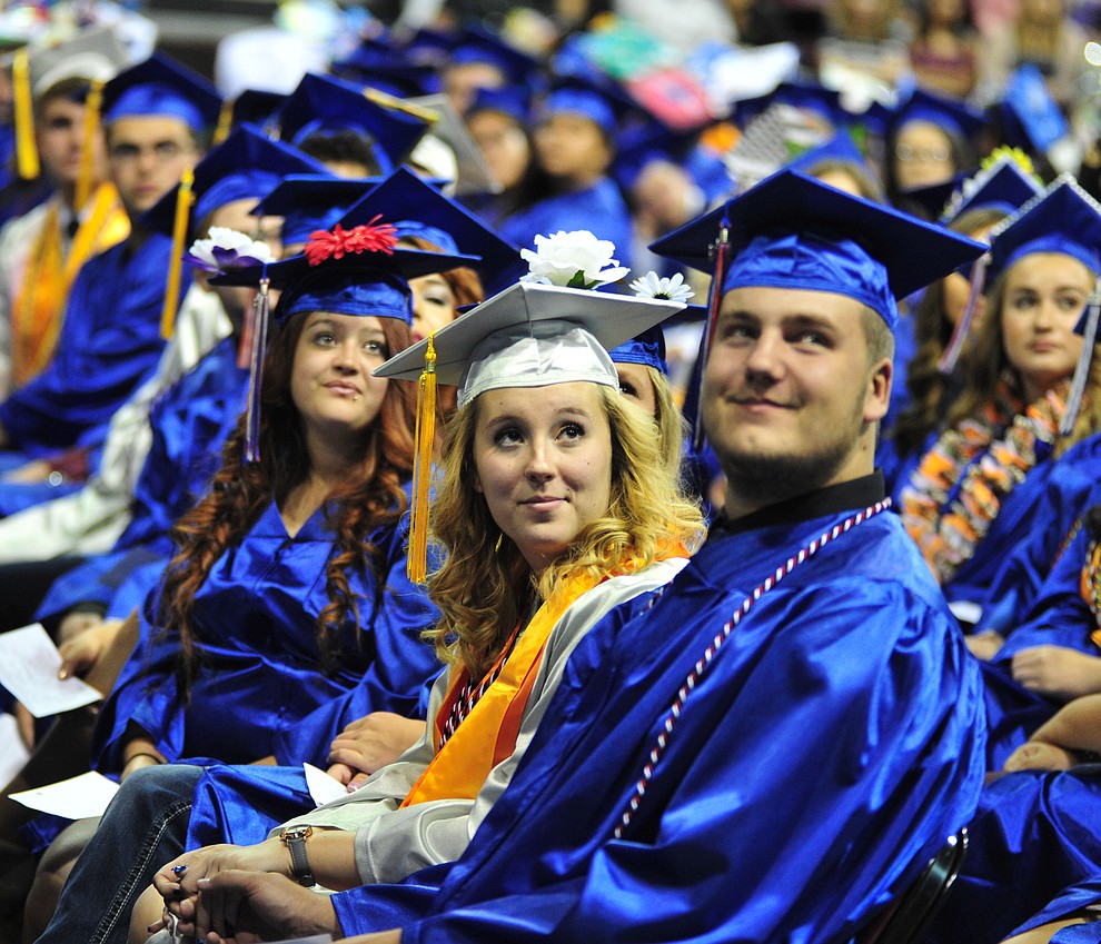 Watching the senior memories video on the big screens at the Chino Valley Commencement held Wednesday, May 23, 2018 at the Prescott Valley Event Center. (Les Stukenberg/Courier)