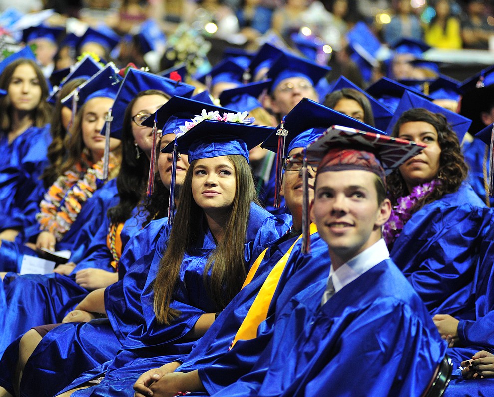 Watching the senior memories video on the big screens at the Chino Valley Commencement held Wednesday, May 23, 2018 at the Prescott Valley Event Center. (Les Stukenberg/Courier)