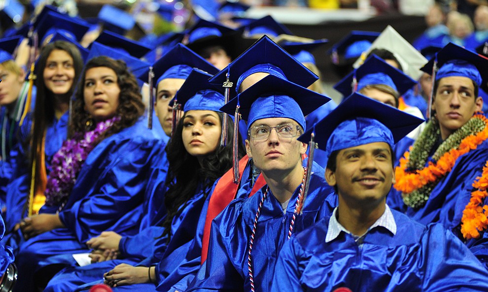 Watching the senior memories video on the big screens at the Chino Valley Commencement held Wednesday, May 23, 2018 at the Prescott Valley Event Center. (Les Stukenberg/Courier)