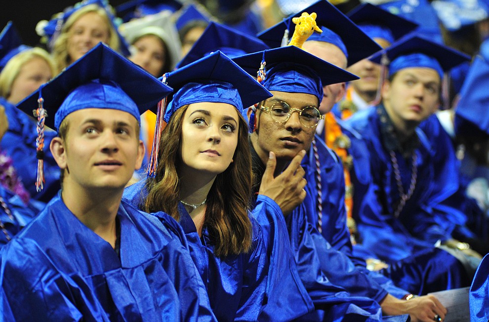 Watching the senior memories video on the big screens at the Chino Valley Commencement held Wednesday, May 23, 2018 at the Prescott Valley Event Center. (Les Stukenberg/Courier)