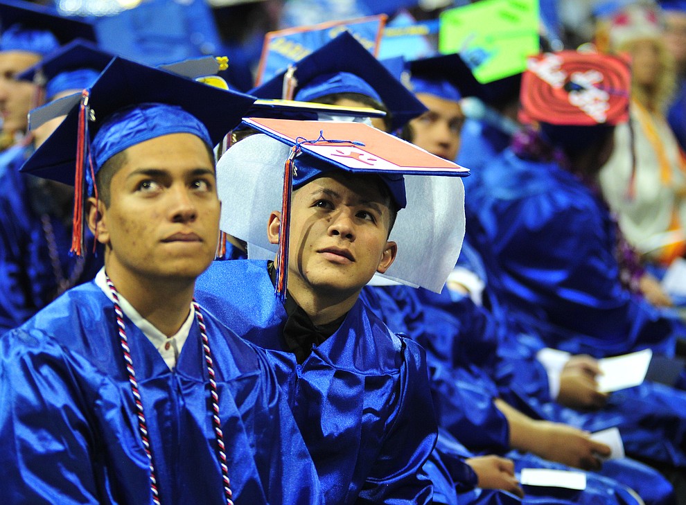 Watching the senior memories video on the big screens at the Chino Valley Commencement held Wednesday, May 23, 2018 at the Prescott Valley Event Center. (Les Stukenberg/Courier)