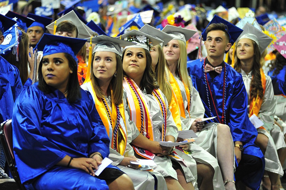 Watching the senior memories video on the big screens at the Chino Valley Commencement held Wednesday, May 23, 2018 at the Prescott Valley Event Center. (Les Stukenberg/Courier)