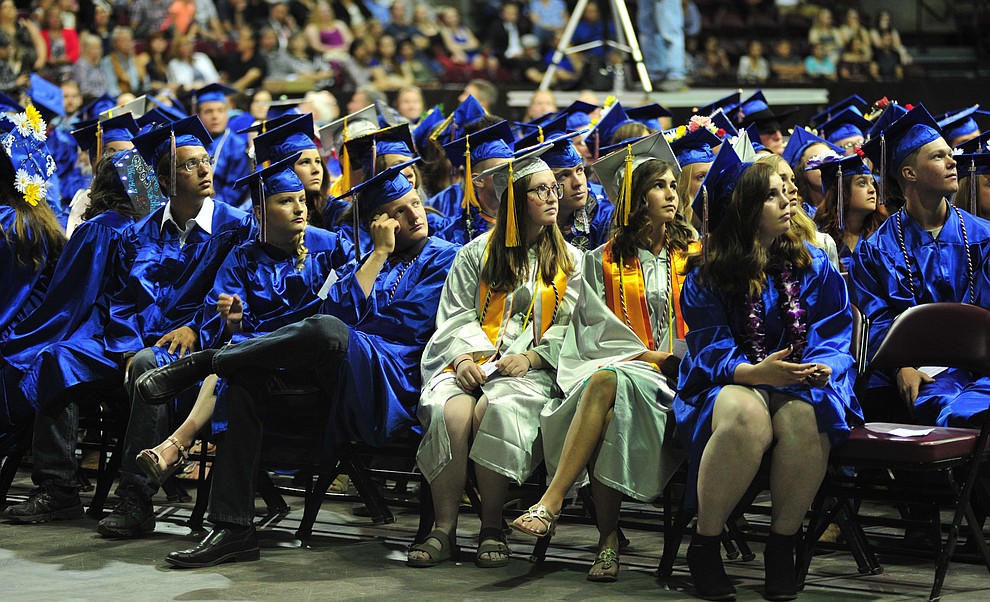 Watching the senior memories video on the big screens at the Chino Valley Commencement held Wednesday, May 23, 2018 at the Prescott Valley Event Center. (Les Stukenberg/Courier)