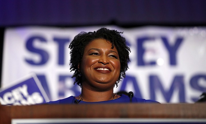 Democratic candidate for Georgia Governor Stacey Abrams smiles as she speaks during an election-night watch party Tuesday, May 22, 2018, in Atlanta. (AP Photo/John Bazemore)

