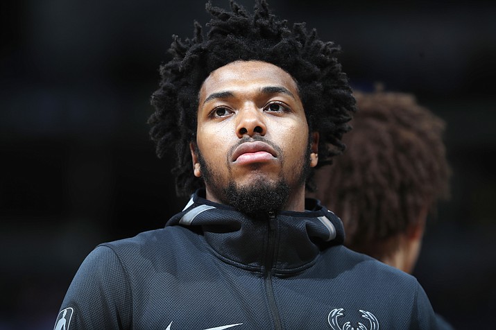 In this April 1, 2018, file photo, Milwaukee Bucks guard Sterling Brown warms up before a game against Denver. (David Zalubowski/AP, File)