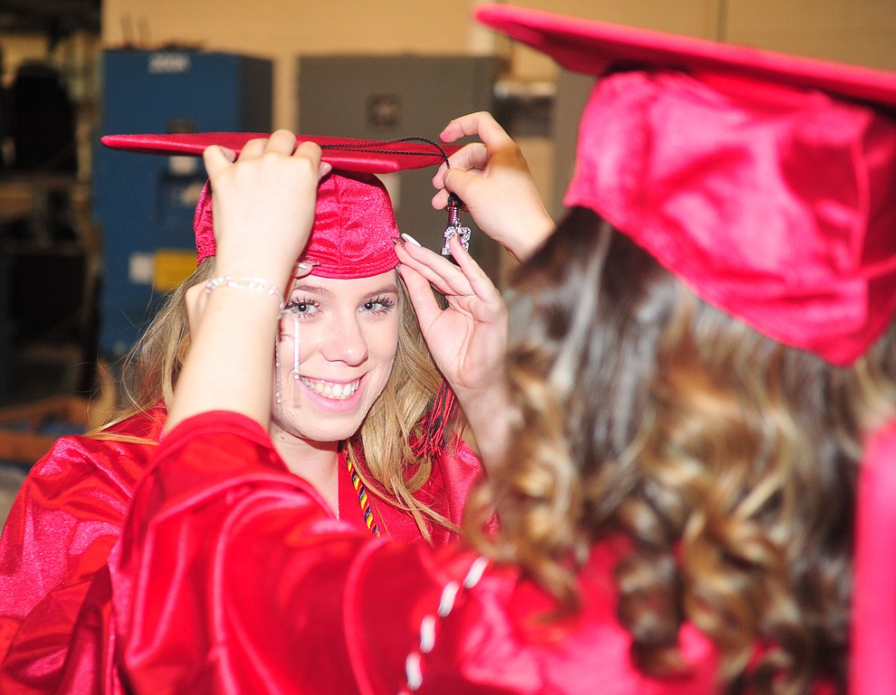Logan Land gets her mortar board adjusted before the 2018 Bradshaw Mountain High School Commencement Ceremony at the Prescott Valley Event Center Thursday, May 24, 2018. (Les Stukenberg/Courier)