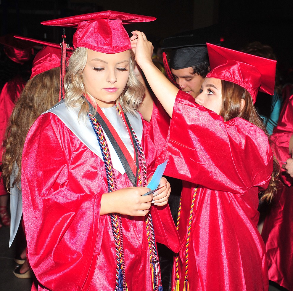 Courtney Stahley and Taylor Shumate get ready for the 2018 Bradshaw Mountain High School Commencement Ceremony at the Prescott Valley Event Center Thursday, May 24, 2018. (Les Stukenberg/Courier)
