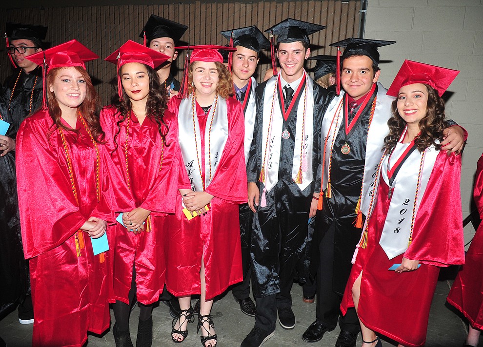Morgen Rogos, Sara Townsend, Dorothy Adams, Alex Puth, David Peterson, Caleb Perkins, Robert Walker and Marlen Morales pose before the 2018 Bradshaw Mountain High School Commencement Ceremony at the Prescott Valley Event Center Thursday, May 24, 2018. (Les Stukenberg/Courier)