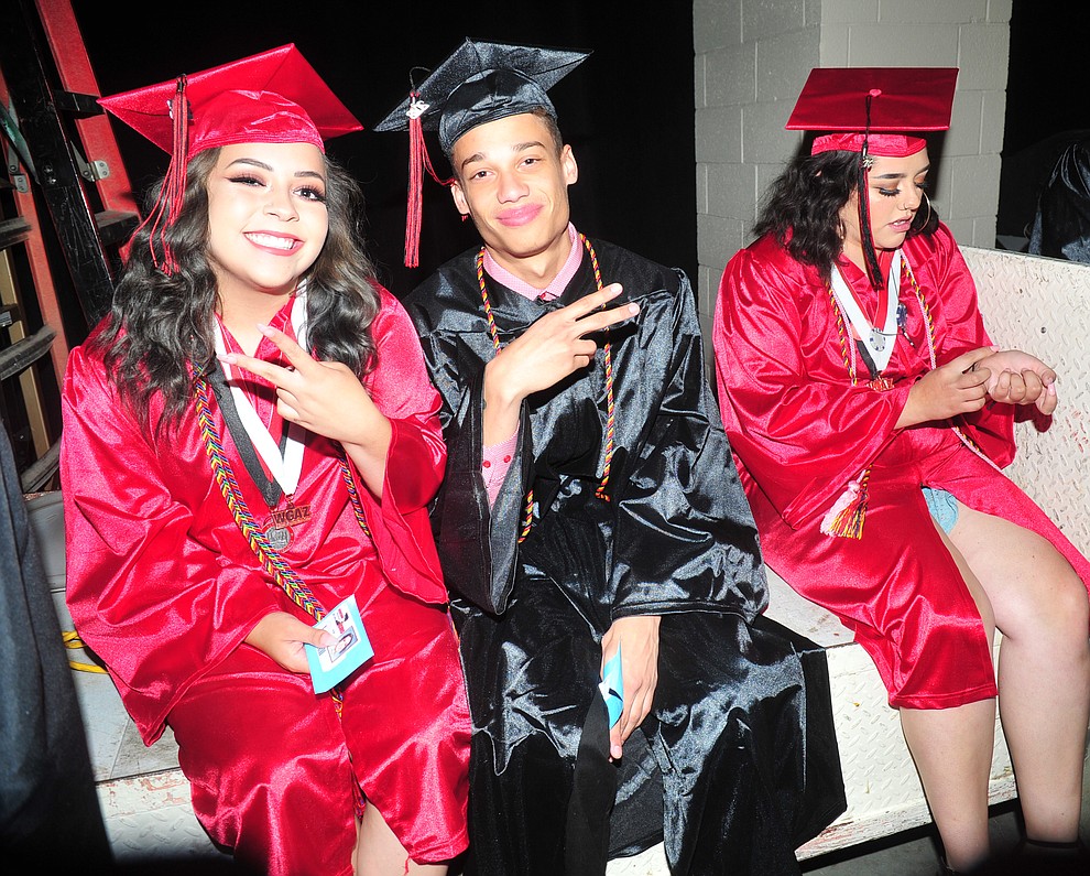 Marissa Ranus, Isaiah Mayse and Dillon McCown find a place to sit before the 2018 Bradshaw Mountain High School Commencement Ceremony at the Prescott Valley Event Center Thursday, May 24, 2018. (Les Stukenberg/Courier)