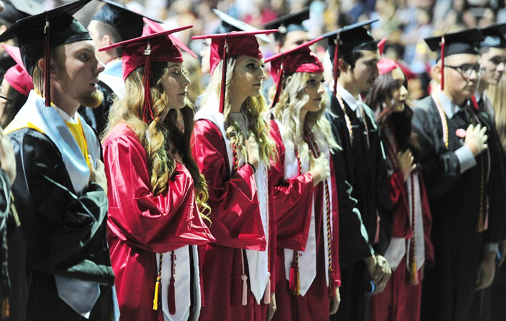 Students stand for the National Anthem during the 2018 Bradshaw Mountain High School Commencement Ceremony at the Prescott Valley Event Center Thursday, May 24, 2018. (Les Stukenberg/Courier)