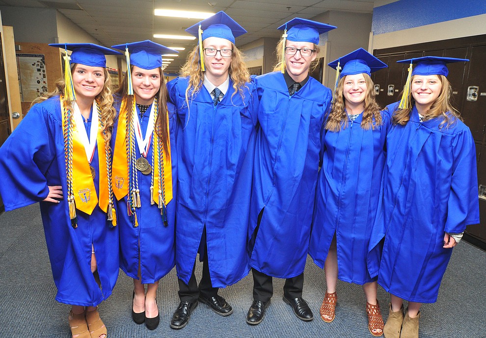 Three sets of identical twins pose before the 2018 Prescott High School Commencement Ceremony at the school Friday, May 25, 2018. From left; Kirsten and Kara Hillig, Jason and Jonah Howard along with Alex and Drew Shumaker (Les Stukenberg/Courier)