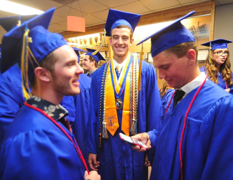 Jacob Henwood, Charles Hicks and Sam Ward share a laugh before the 2018 Prescott High School Commencement Ceremony at the school Friday, May 25, 2018. (Les Stukenberg/Courier)
