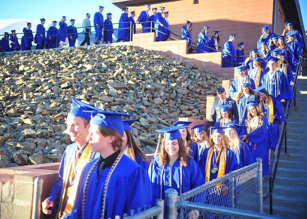 Students walk towards the field and their graduation during the 2018 Prescott High School Commencement Ceremony at the school Friday, May 25, 2018. (Les Stukenberg/Courier)