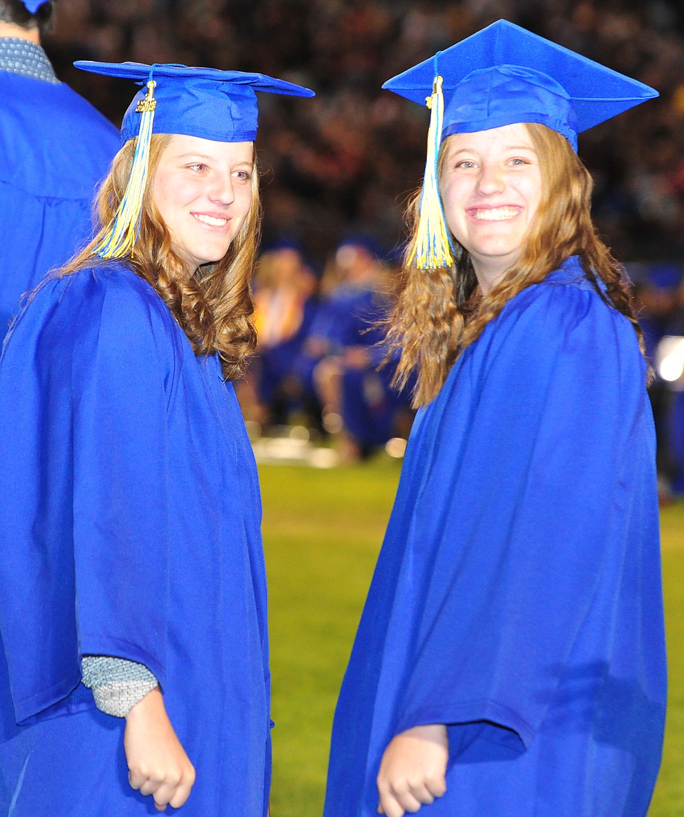 Alex and Drew Shumaker wait to get their diploma during the 2018 Prescott High School Commencement Ceremony at the school Friday, May 25, 2018. (Les Stukenberg/Courier)