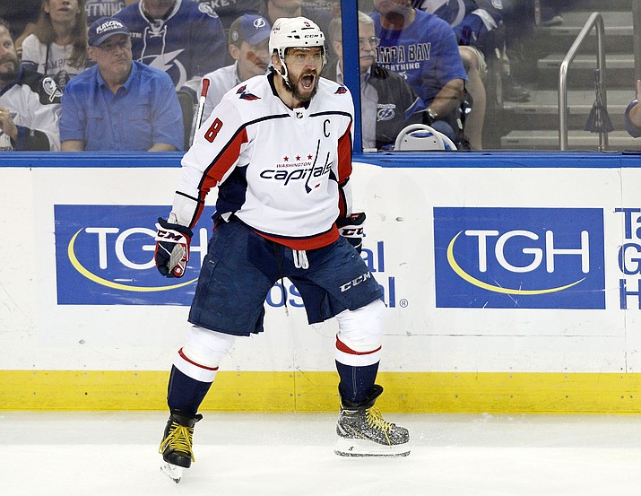 In this Wednesday, May 23, 2018, image, Washington Capitals left wing Alex Ovechkin celebrates a goal against the Tampa Bay Lightning during the first period in Game 7 of the NHL Eastern Conference finals playoff hockey series in Tampa, Fla. Ovechkin is having fun, scoring goals, leading the Capitals to the Stanley Cup Final and destroying the bad rep some laid on him for not being able to get past the second round of the playoffs. (Jason Behnken/AP, File)