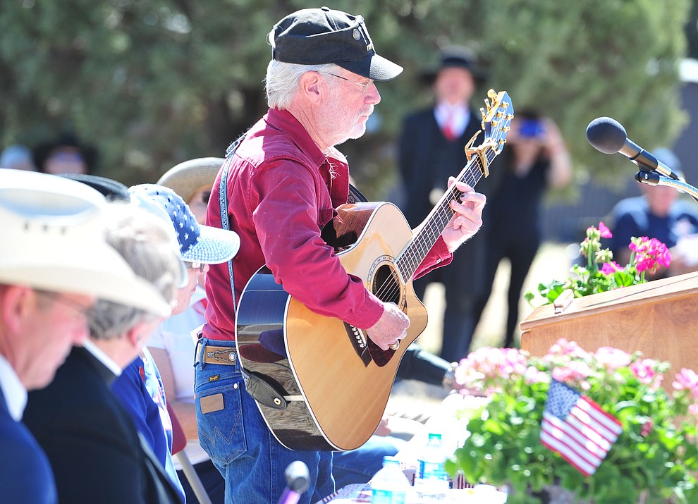 Vietnam veteran Jack Brugger plays "God Bless the USA" at the Citizens Cemetery Memorial Day program Monday, May 28, 2018 in Prescott Prescott. (Les Stukenberg/Courier)