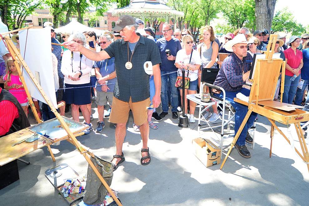 Bill Cramer using oils and TJ Thompson using acrylics compete during the quick draw contest at the 44th Annual Phippen Museum Western Art Show on the courthouse plaza Saturday, May 26, 2018 in downtown Prescott. (Les Stukenberg/Courier)