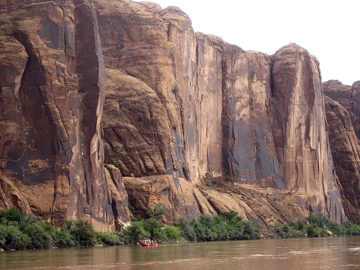 In this July 25, 2017, file photo, rafters float down the Colorado River near Moab, Utah. Rivers are drying up, popular mountain recreation spots are closing and water restrictions are in full swing as a persistent drought intensifies its grip on pockets of the American Southwest. (AP photo/Dan Elliott, File)