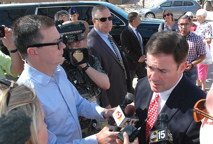 Gov. Doug Ducey answers questions Monday on his views on teaching evolution in public schools. (Capitol Media Services photo by Howard Fischer)