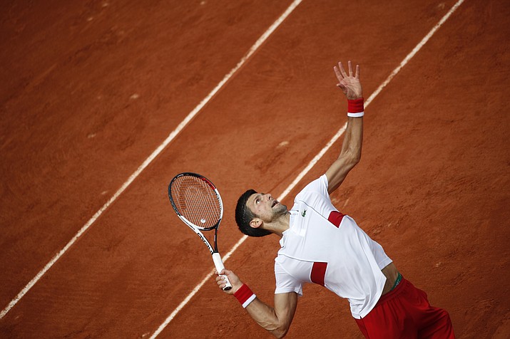 Serbia’s Novak Djokovic serves against Spain’s Jaume Munar during their second round match of the French Open tennis tournament at the Roland Garros stadium in Paris, France, Wednesday, May 30, 2018. (AP Photo/Christophe Ena)