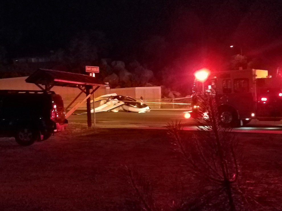 The Piper Malibu, single-engine prop plane contacted the Prescott Airport Tower reporting that it had a low fuel emergency at about 9 p.m. Tuesday. The pilot was trying to reach the airport, but was forced to attempt an emergency landing on Iron Springs Road. The three people on board survived the crash. (Armando Rodarte/Courier)