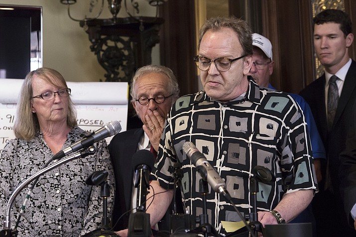 Jamie Heutmaker, a victim of abuse by a priest in the late 1960s, thanks the people who've helped him through the legal and emotional processes, during a press conference detailing the settlement reached between clergy sexual abuse victims and the Archdiocese of St. Paul and Minneapolis, at his office on Thursday, May 31, 2018, in St. Paul, Minn. . (Lacey Young/Minnesota Public Radio via AP)

