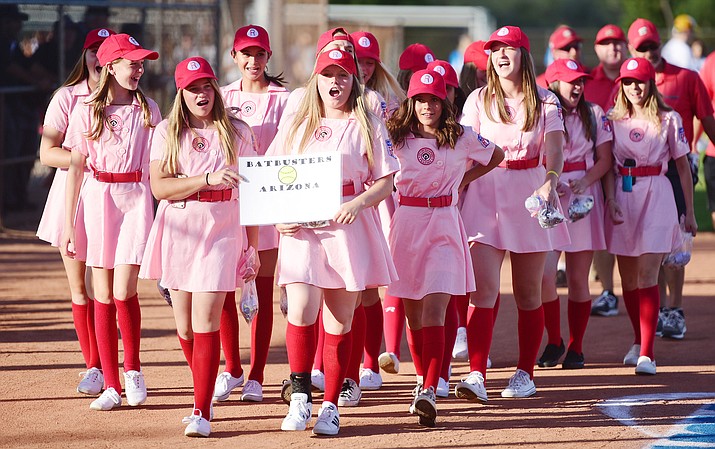 The Arizona Batbusters march in their Rockford Peaches throwback uniforms during the opening ceremonies at the National Softball Association Southwest World Series at Pioneer Park in Prescott Wednesday, July 26, 2017. (Les Stukenberg/Courier, file)