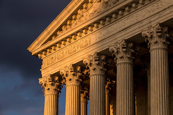 In this Oct. 10, 2017, file photo, the Supreme Court in Washington is seen at sunset. A flood of lawsuits over LGBT rights is making its way through the courts and will continue, no matter the outcome in the Supreme Court's highly anticipated decision in the case of a Colorado baker who would not create a wedding cake for a same-sex couple. (AP Photo/J. Scott Applewhite, File)

