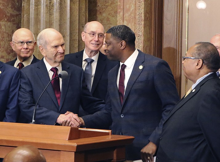 In this May 17, 2018, file photo, Mormon church President Russell M. Nelson shakes hands with Derrick Johnson, president of the NAACP during a news conference, in Salt Lake City. The Mormon church on Friday, June 1, 2018, will celebrate the 40th anniversary of reversing its ban on black people serving in the lay priesthood, going on missions or getting married in temples, rekindling debate about one of the faith’s most sensitive topics. (AP Photo/Rick Bowmer, File)


