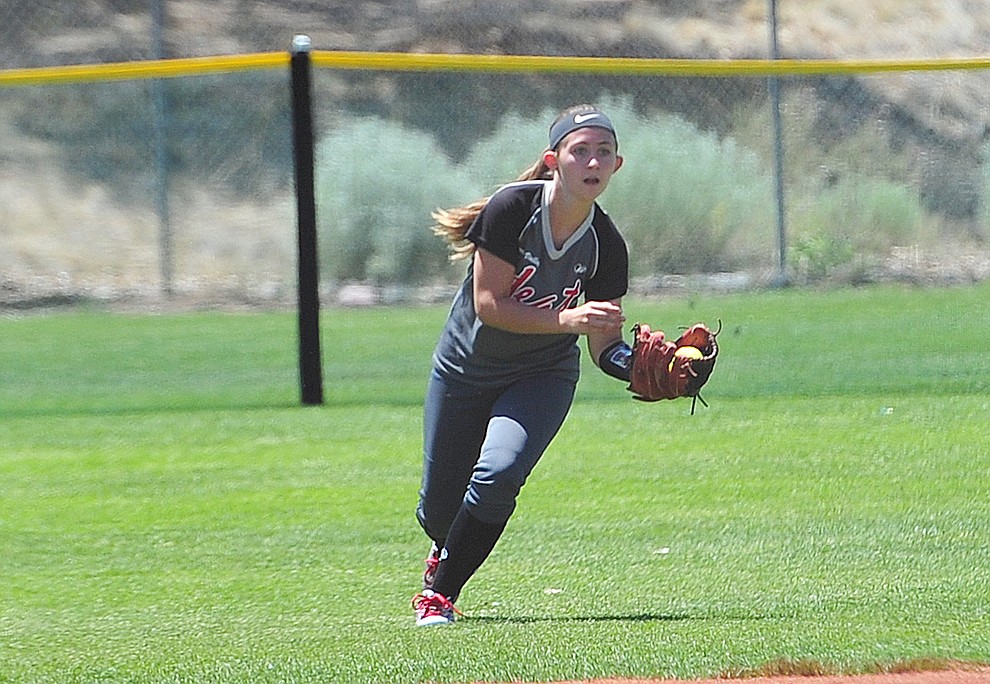 Verde Valley Heat Elite 14U's Makena Watson makes a play in right field at the Schools Out for Summer NSA fastpitch girls softball tournament at Pioneer Park in Prescott Saturday, June 2, 2018. (Les Stukenberg/Courier)