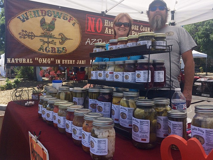 Pam Baker and Dave Harris of Windswept Acres at the Prescott Farmers Market Saturday, June 2. They’ll be selling at the Chino Valley Farmers Market which starts its 11th year Thursday, June 7. (Jason Wheeler/Review)