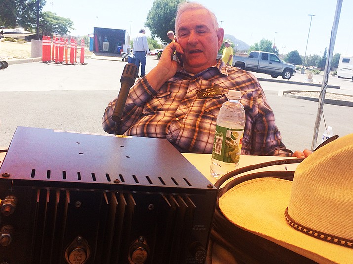 John Laine, also known as K7PRS of the Yavapai Amateur Radio Club, makes contact on a ham radio at the Prescott HAMFest Saturday, June 2, 2018. (Jason Wheeler/Courier)