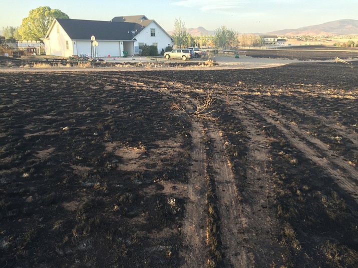 Grass surrounding the home of Ryan and Carrine Judy was burned during the Viewpoint Fire, as evidenced by this May 11 photo. (Ryan Judy/Courtesy)
