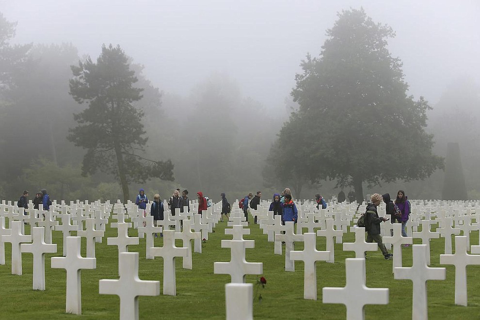 School children visit the Colleville American military cemetery, in Colleville sur Mer, western France, Wednesday June 6, 2018, on the 74th anniversary of the D-Day landing. U.S. and other allied troops have joined veterans of the D-Day invasion and families of fallen soldiers to mark 74 years since the massive military operation that change the course of World War II. (AP Photo/David Vincent)