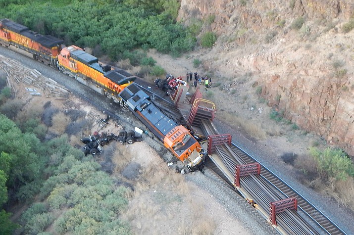 A Burlington Northern Santa Fe Railway train collided with a train pushing maintenance equipment belonging to Herzog Railroad Services Tuesday afternoon, June 5, 2018 in a remote canyon near Truxton, Arizona. One man was killed and another had to be airlifted to a Las Vegas hospital. (Mohave County Sheriff's Office)