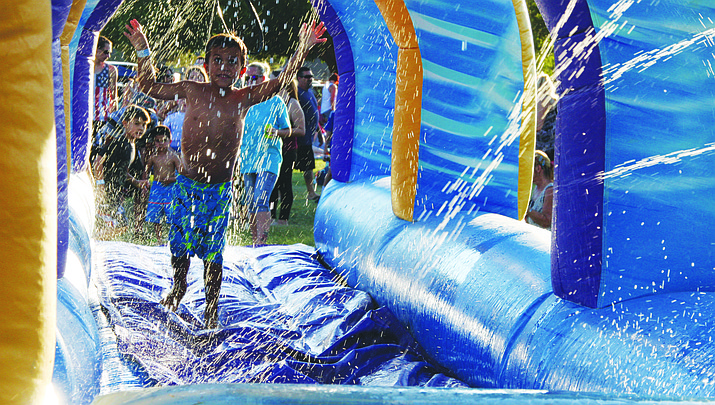Prior to Cottonwood’s July 4 firewords display, the Cottonwood Kids Park will come alive with games, water slide, inflatable rides and watermelon eating contests. Photo courtesy City of Cottonwood Parks and Recreation.