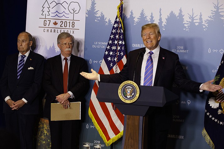 White House chief economic adviser Larry Kudlow, left, and National Security Adviser John Bolton look on as President Donald Trump speaks during a news conference at the G-7 summit, Saturday, June 9, 2018, in La Malbaie, Quebec, Canada. (AP Photo/Evan Vucci)

