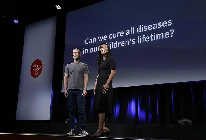 In this Sept. 20, 2016, file photo, Facebook CEO Mark Zuckerberg and his wife, Priscilla Chan, prepare for a speech in San Francisco. The Giving USA report, released Tuesday, June 12, 2018, said giving from individuals, estates, foundations and corporations reached an estimated $410 billion in 2017. The biggest increase was in giving to foundations, up 15.5 percent. This surge was driven by large gifts by major philanthropists to their own foundations, including $2 billion from Zuckerberg and Chan. (AP Photo/Jeff Chiu, File)

