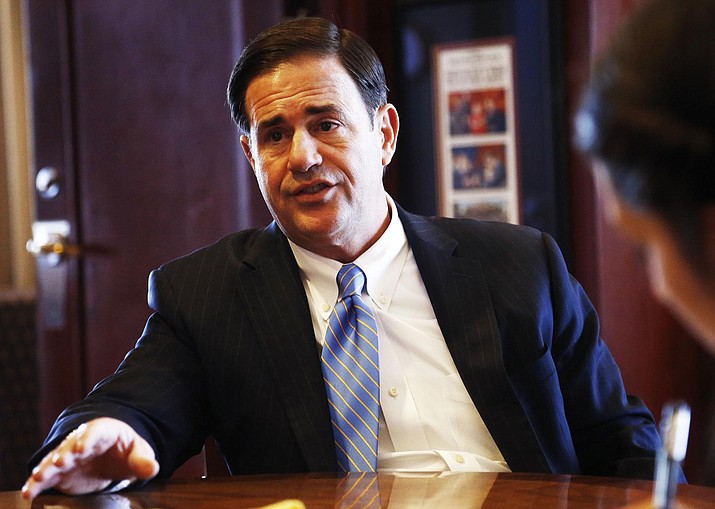 In this file photo Republican Gov. Doug Ducey speaks about a variety of issues during an interview in his office at the Arizona Capitol Tuesday, May 8, 2018, in Phoenix. (AP Photo/Ross D. Franklin)