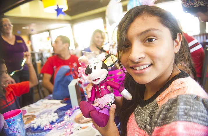 Ana Gutierrez, finds out at the Prescott Denny’s Restaurant, Sunday, June 10, 2018, that she and her family received a trip to Disneyland made possible through the Make-A-Wish Foundation with contributions from Denny’s. (Courtesy photo)