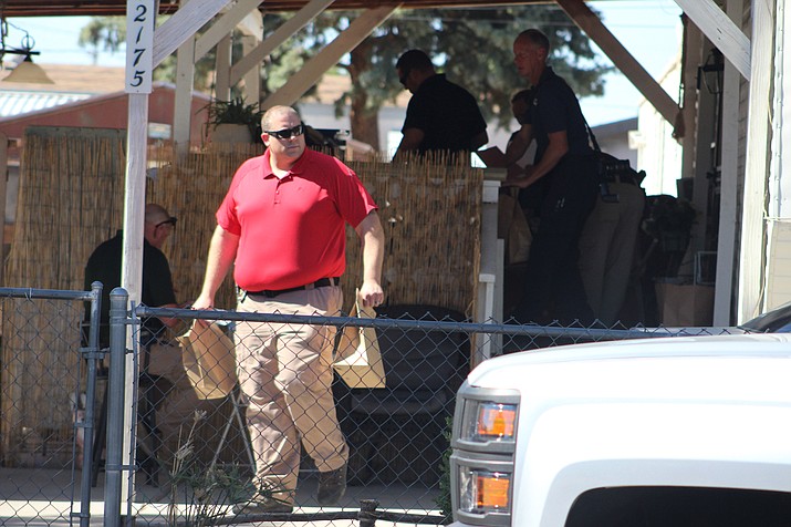 Two people at a Kingman home were detained for questioning on June 12, 2018, about $170,000 cash lost at the Kingman Walmart last week. (Photo by Beau Bearden/Kingman Daily Miner)