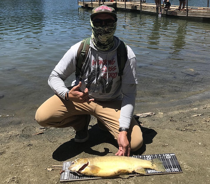 Avondale resident David Worsham proudly displays his catch, a 23-inch, 5.12-pound Gila trout, out of the waters of Goldwater Lake on June 2 in Prescott. The Arizona Game and Fish Department believes it’s a new state record. (AZGFD/Courtesy)
