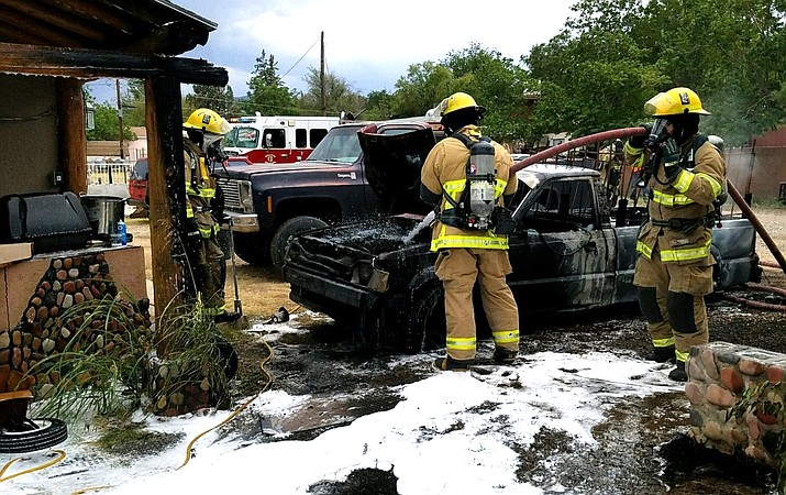 The older model Mazda pickup truck is a total loss and damage estimates to the two homes is $6,000. Photo courtesy City of Cottonwood  