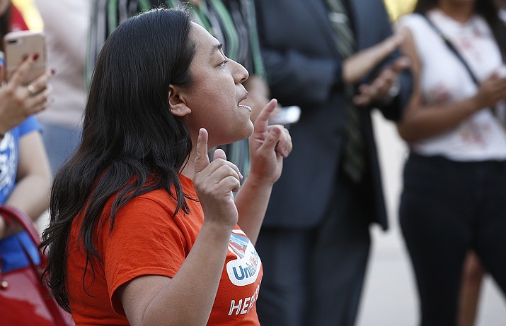 Karina Ruiz, of the Arizona Dream Act Coalition, shouts in protest of the Arizona Supreme Court ruling against young immigrants granted deferred deportation status under the 2012 Deferred Action for Childhood Arrivals program, during a demonstration at the Arizona Capitol in Phoenix on Monday, April 9, 2018. (Ross D. Franklin/AP)