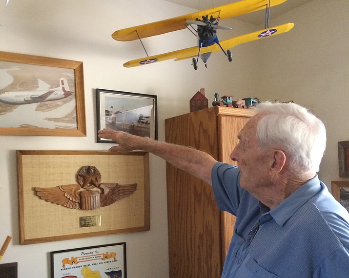 Bob Bakken looks at models he built of planes he flew as a pilot in the United States Air Force between 1950 and 1976. Bakken, a Minnesota native and University of Minnesota graduate, retired as a lieutenant colonel. (Nanci Hutson/Courier)