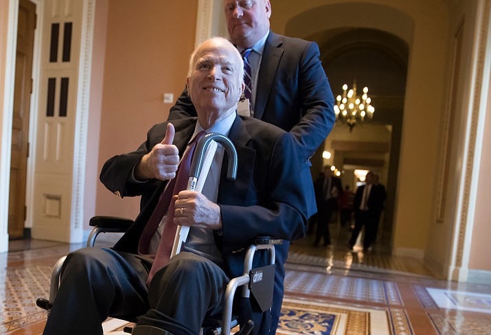 In this Dec. 1, 2017 file photo, Sen. John McCain, R-Ariz., leaves a closed-door session on Capitol Hill in Washington. (J. Scott Applewhite/AP, file)