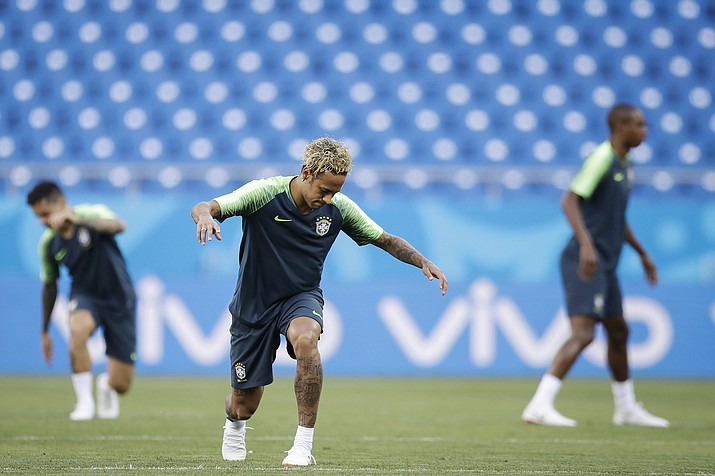 Brazil’s Neymar stretches during Brazil’s official training on the eve of the group E match between Brazil and Switzerland at the 2018 soccer World Cup in the Rostov Arena in Rostov-on-Don, Russia, Saturday, June 16, 2018. (AP Photo/Felipe Dana)

