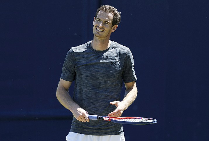 Britain’s Andy Murray smiles during a practice session on day one of the Queen’s Club Championship at the Queens Club, in London, Monday June 18, 2018. (Steven Paston/PA via AP)