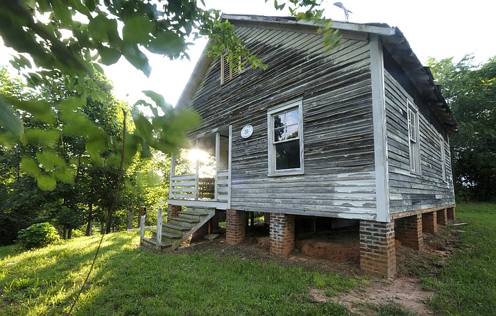 This undated handout photo made available by Nancy Pierce shows the birthplace of jazz singer Nina Simone in Tryon, NC. The dilapidated wooden cottage in North Carolina that was the birthplace of singer and civil rights activist Nina Simone now has the protection of the National Trust for Historic Preservation. The trust said in a news release Tuesday, June 19, 2018, that it will develop and find a new use for the house in Tryon where Simone was born in 1933. Last year, four African-American artists purchased the home. (Nancy Pierce via AP)


