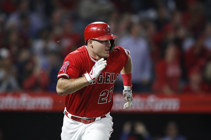 Los Angeles Angels' Mike Trout runs to first base after hitting a two-run single during the fifth inning of the team's baseball game against the Arizona Diamondbacks, Tuesday, June 19, 2018, in Anaheim, Calif. (Jae C. Hong/AP)